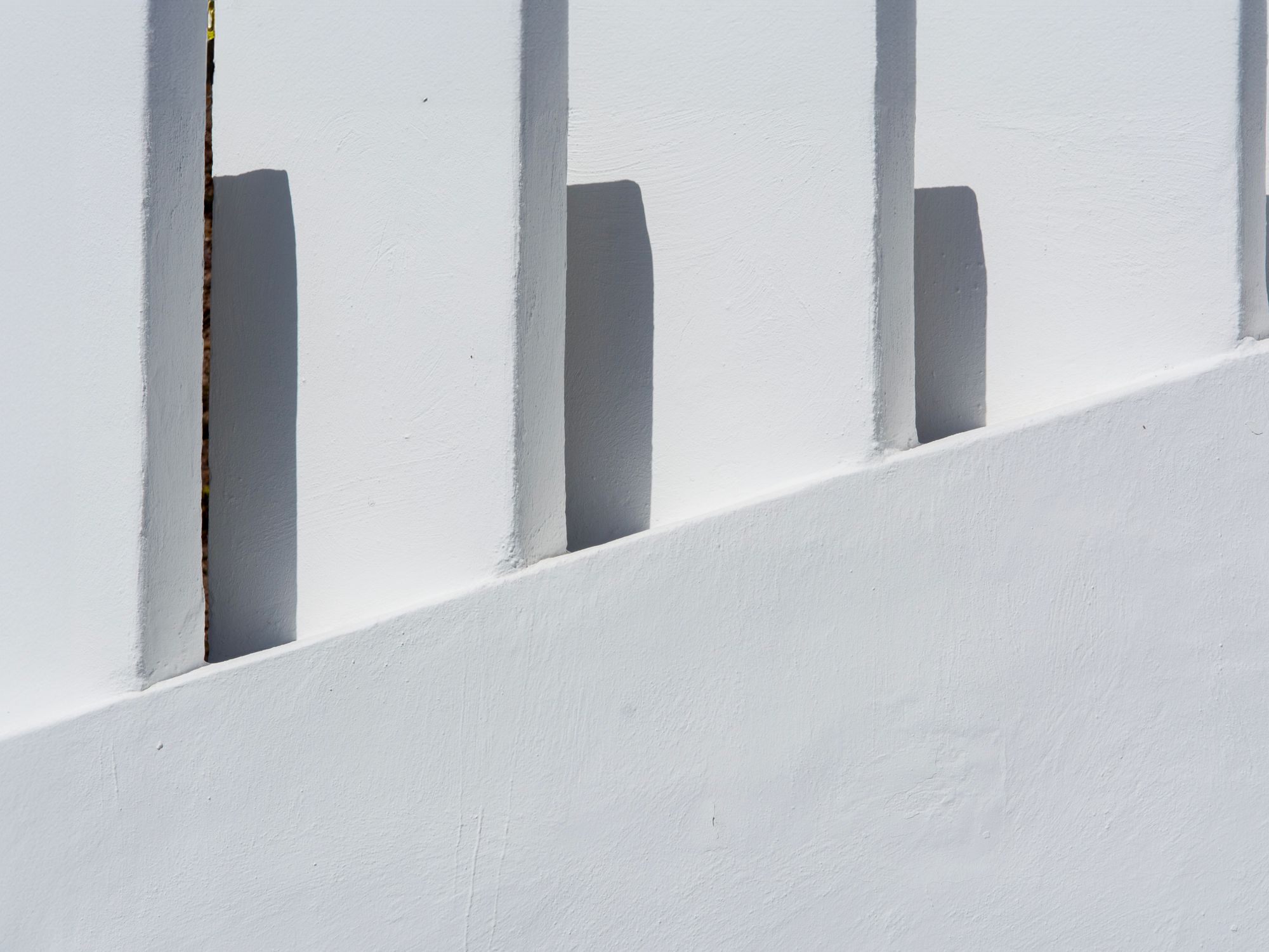 Painters & Decorators in Kenton, London — professional decorator painting a wall with a roller