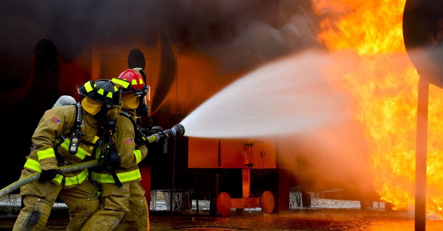Red fire extinguishers in a row