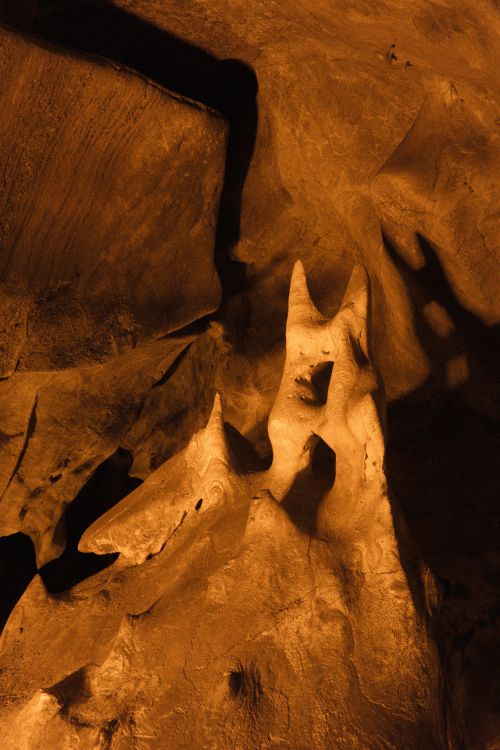 Free Explore unique limestone stalactite formations in an ancient cave environment. Stock Photo