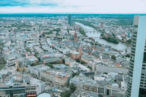 Free Stunning aerial view of Frankfurt showing urban skyline, river, and landmarks. Stock Photo