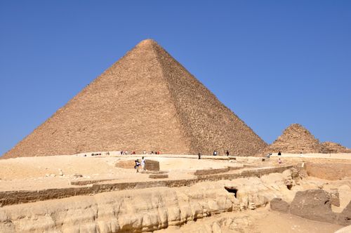 Free The iconic Great Pyramid of Giza stands tall under a clear blue sky, capturing ancient Egyptian wonder. Stock Photo