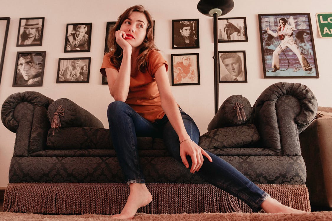 Photo of Woman Sitting On Couch