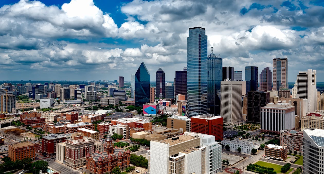 Free Aerial Photo of City Under White Clouds Stock Photo