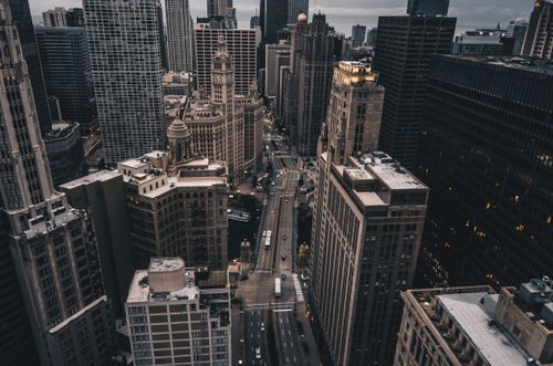 Free Discover the majestic skyscrapers and urban streets of downtown Chicago in this stunning aerial cityscape. Stock Photo