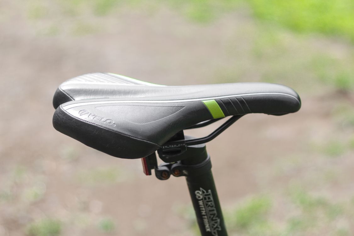 Free Close-up view of a black bicycle saddle in an outdoor setting, capturing details. Stock Photo
