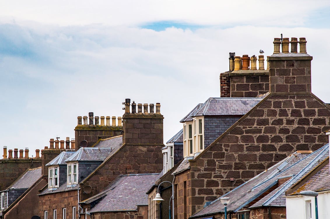 Several brick houses with chimneys