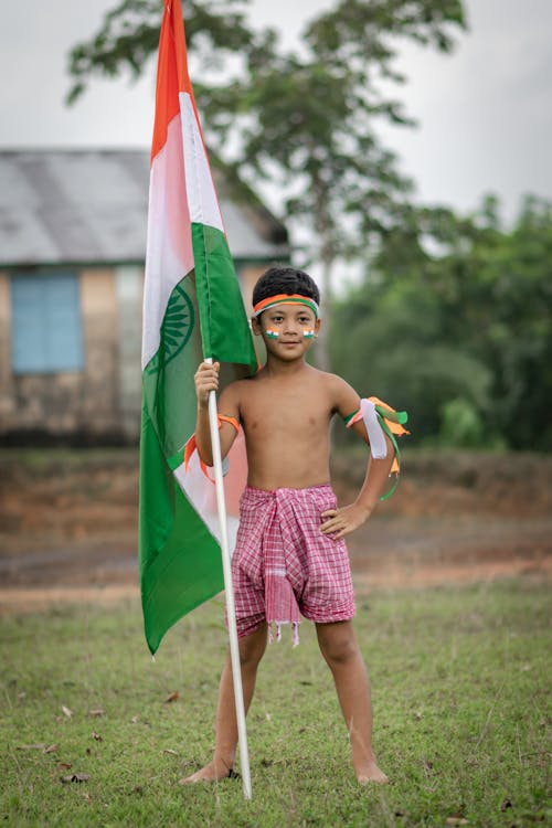 Free Boy Holding a Flag of India Stock Photo