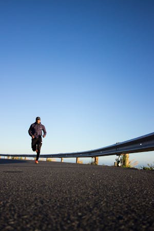 Man Running During Daytime for Stress Relief