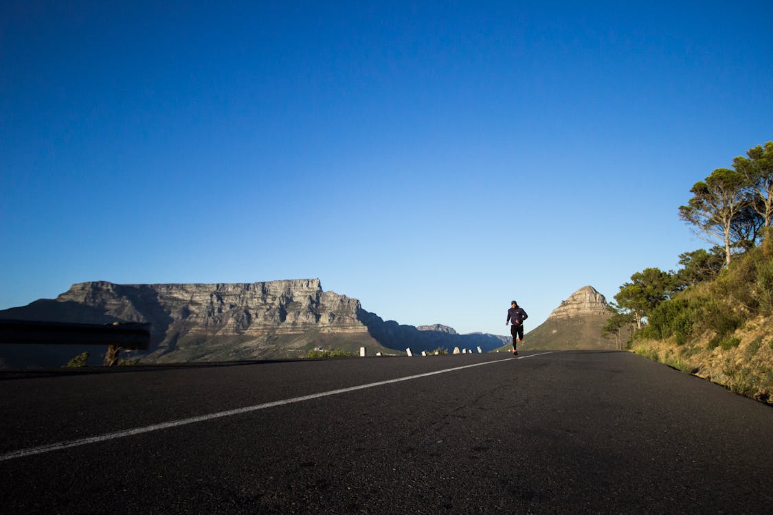 Photo Of Man Running During Daytime