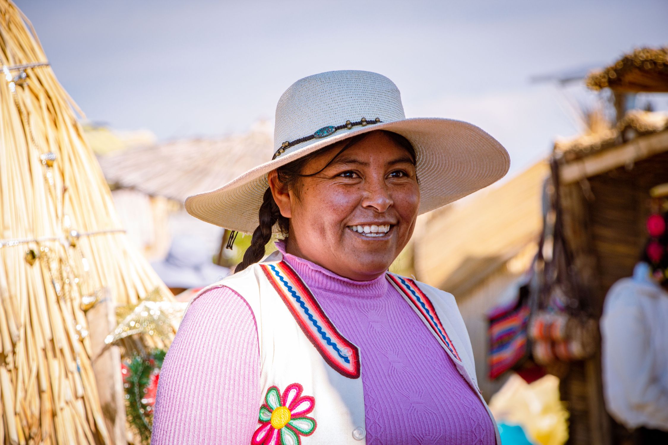 What Makes a Destination Ideal for Ethical Tourism 1 free photo of smiling woman in white sun hat and embroidered vest