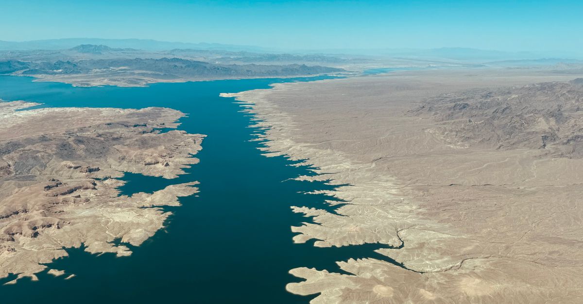 Expansive aerial view showing Lake Mead along the Colorado River with a desert landscape.