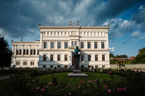 Free Beautiful neoclassical architecture in Lund, Sweden, with a scenic garden in front. Stock Photo