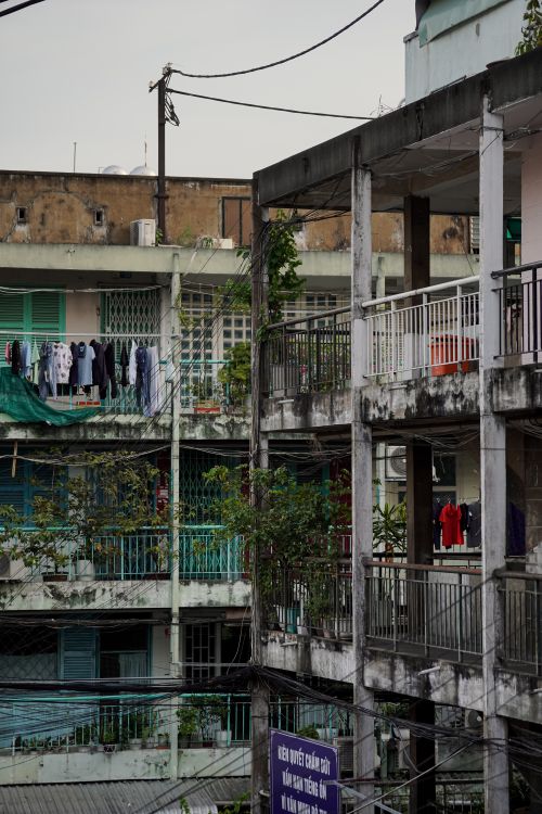 Free Explore the rustic charm of old Saigon's urban apartment life captured in Ho Chi Minh City. Stock Photo