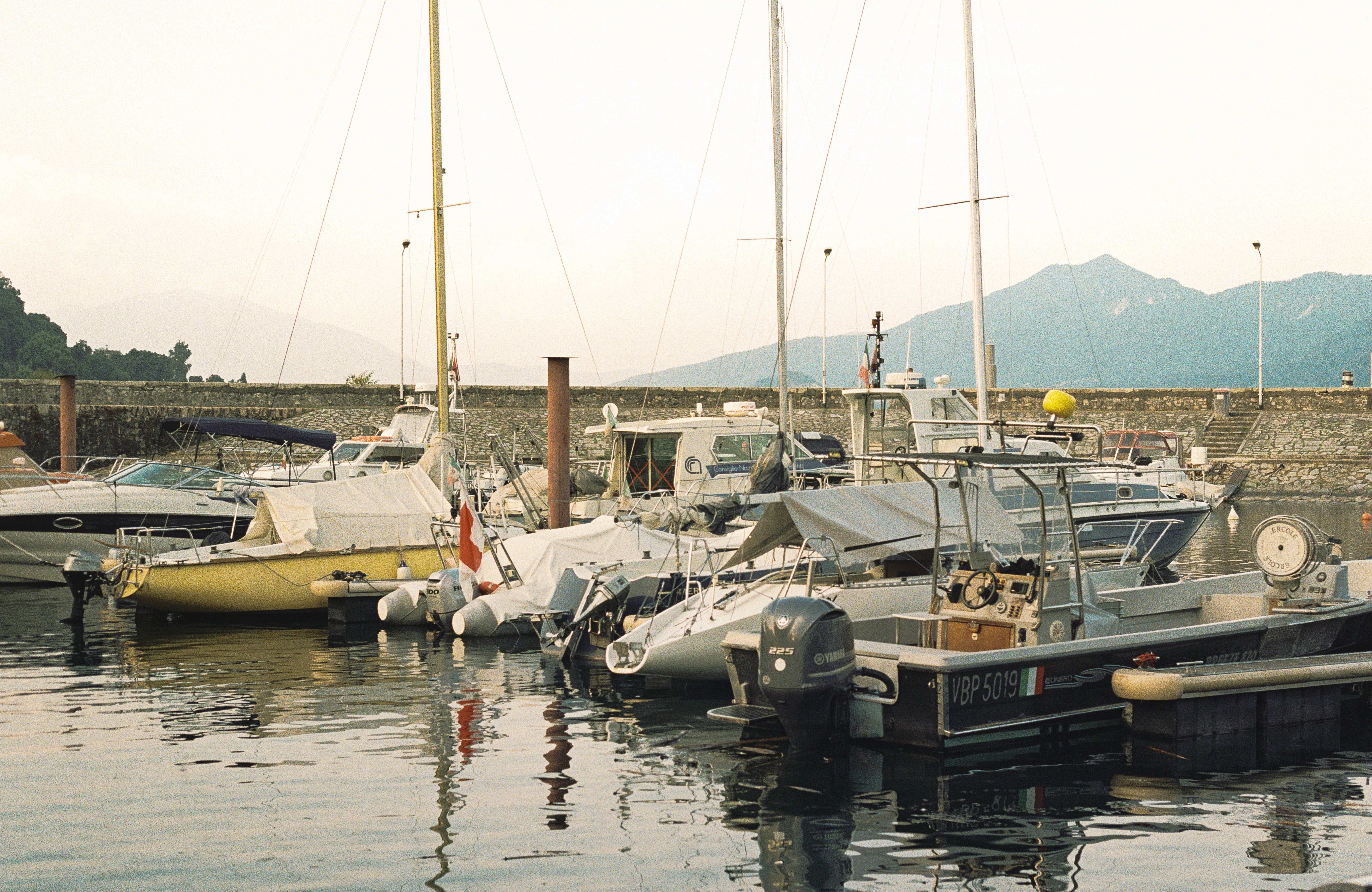 A group of boats are docked in a harbor · Free Stock Photo