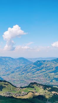 Captivating view of mountains and valley under a vibrant blue sky, perfect for travel inspiration.
