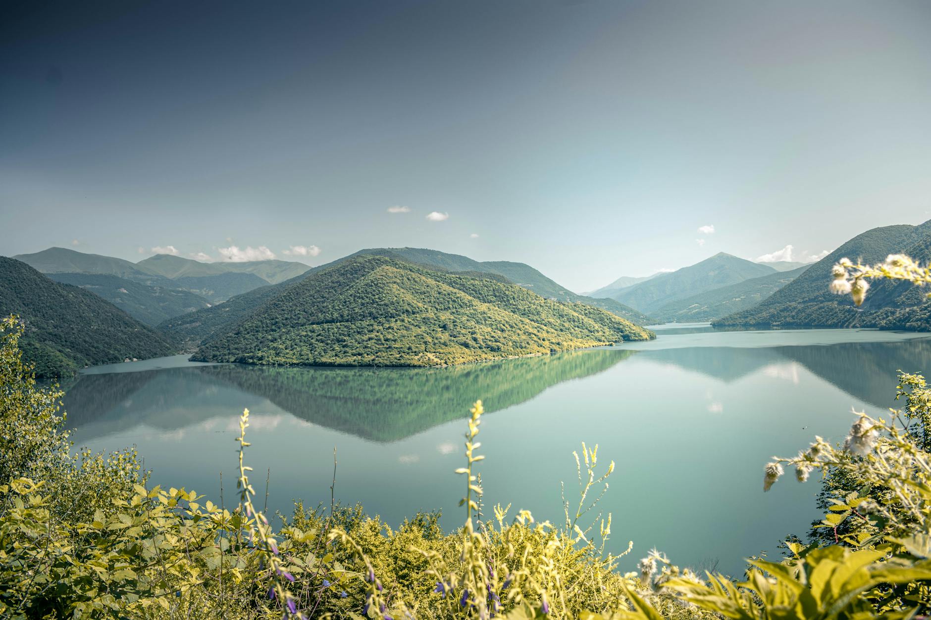 Rolling hills over a lake. 