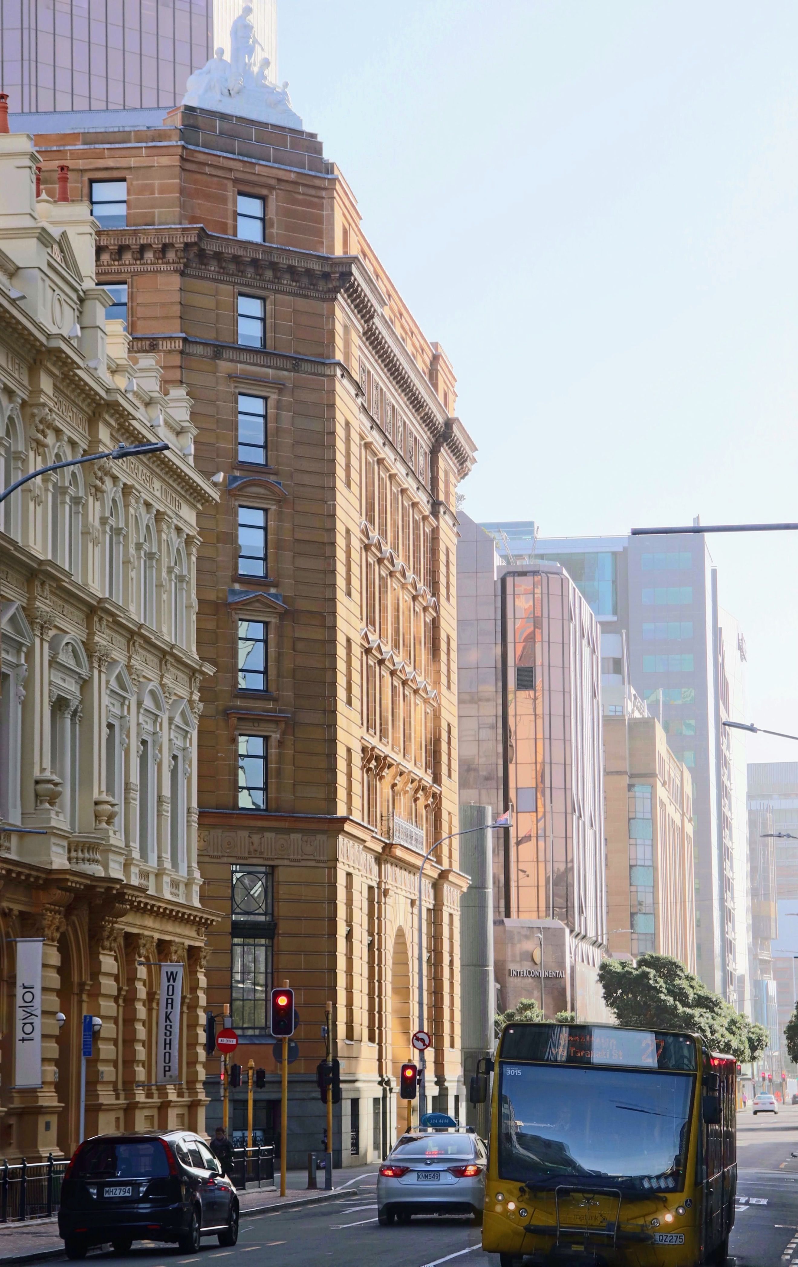 Vibrant morning street view of Wellington's architectural buildings and city life.