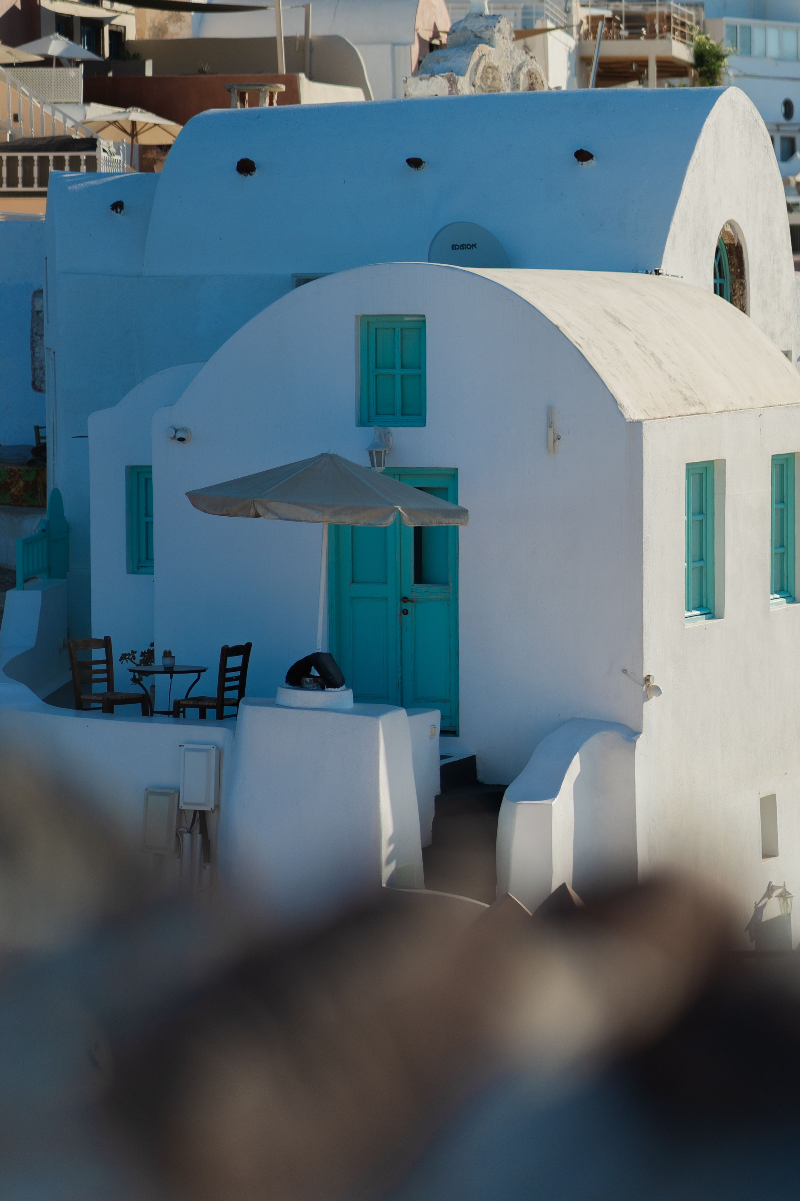 A white house with blue doors and a blue roof · Free Stock Photo