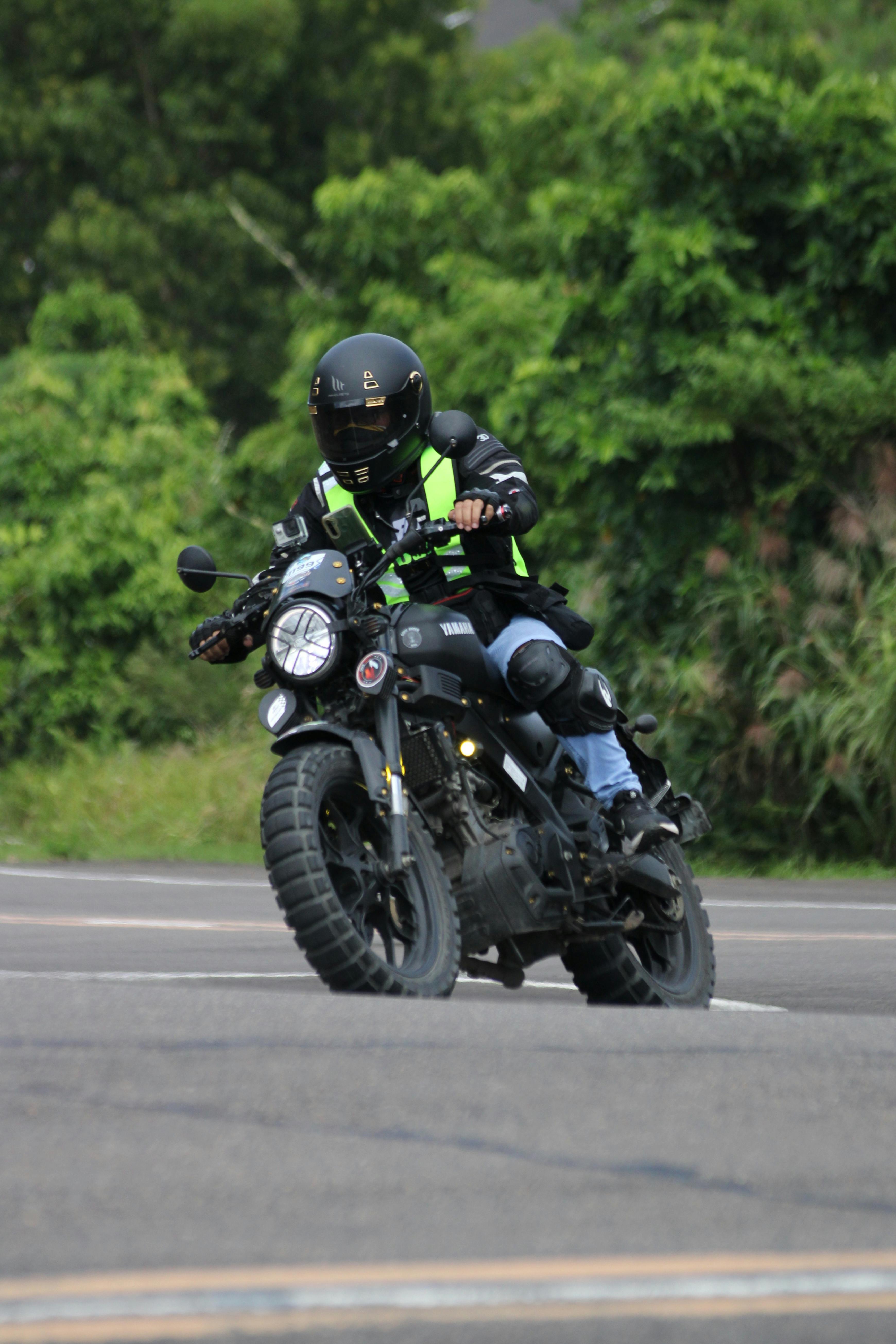 a person riding a motorcycle on a road