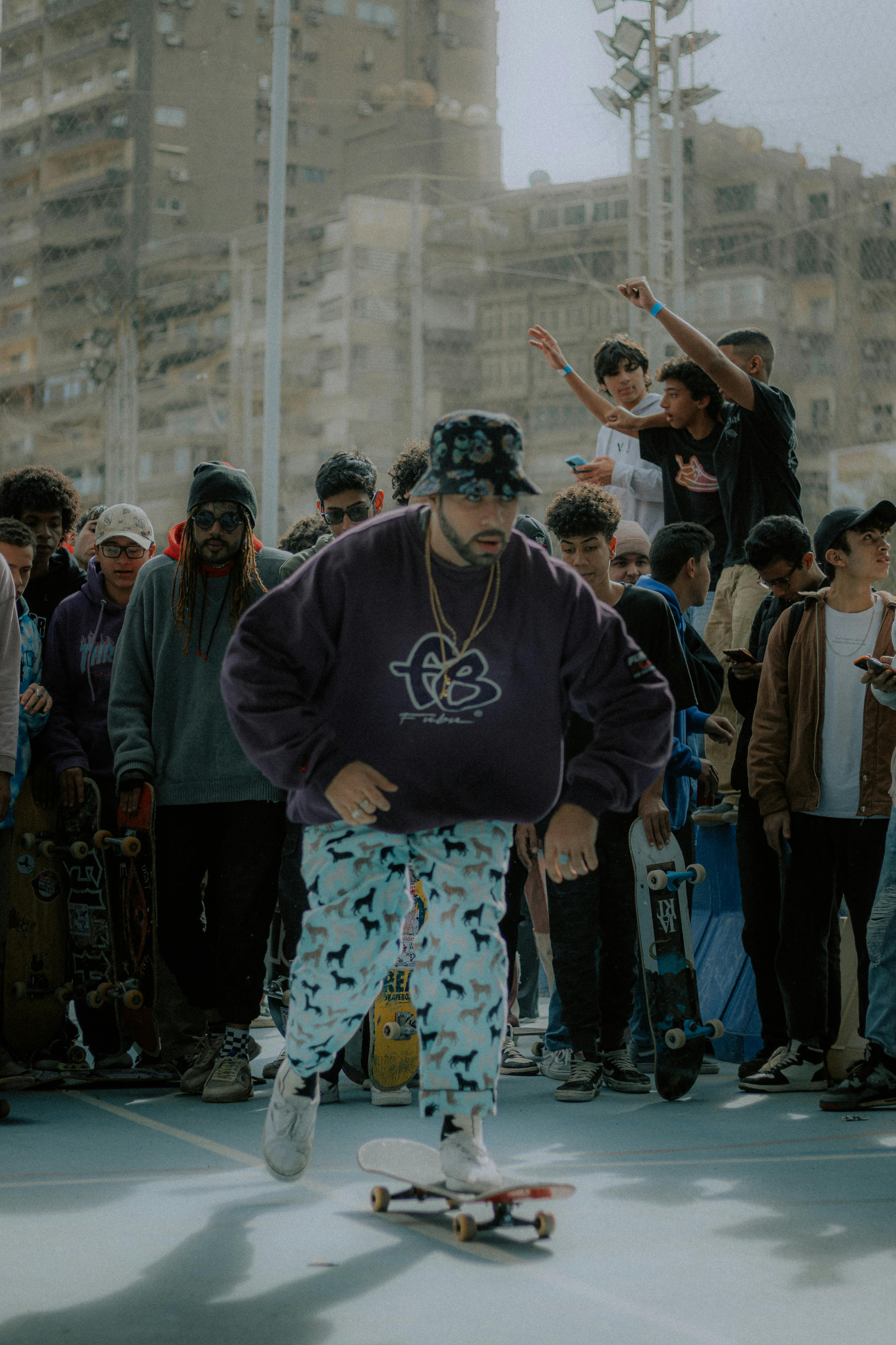 A skateboarder showcases skills in a lively street event in Giza, Egypt.