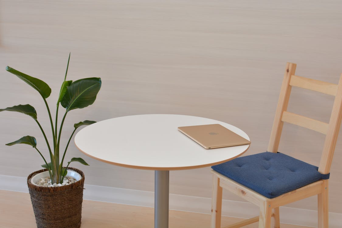 Macbook on Pedestal Table