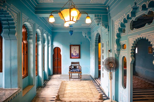 Beautifully designed Udaipur interior showcasing traditional Rajasthani architecture with intricate arches and vibrant colors.