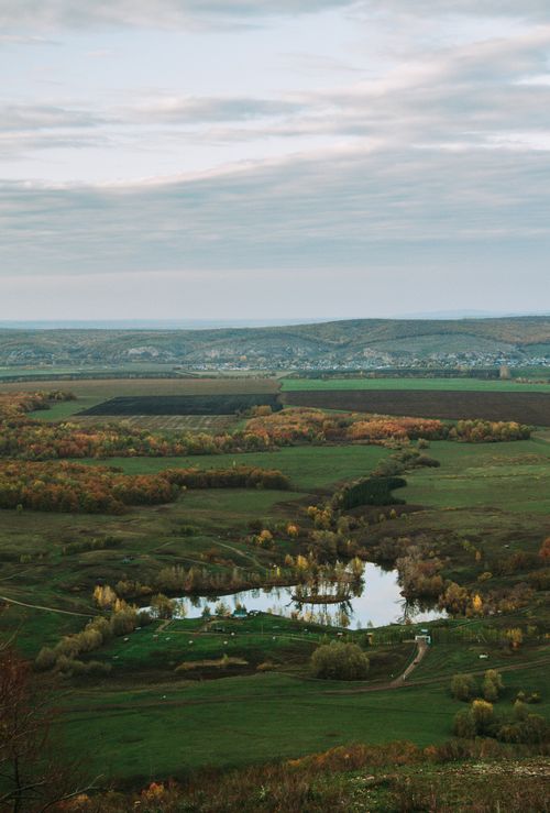 Free Explore a picturesque autumn landscape featuring fields and a serene river in Bashkortostan, Russia. Stock Photo