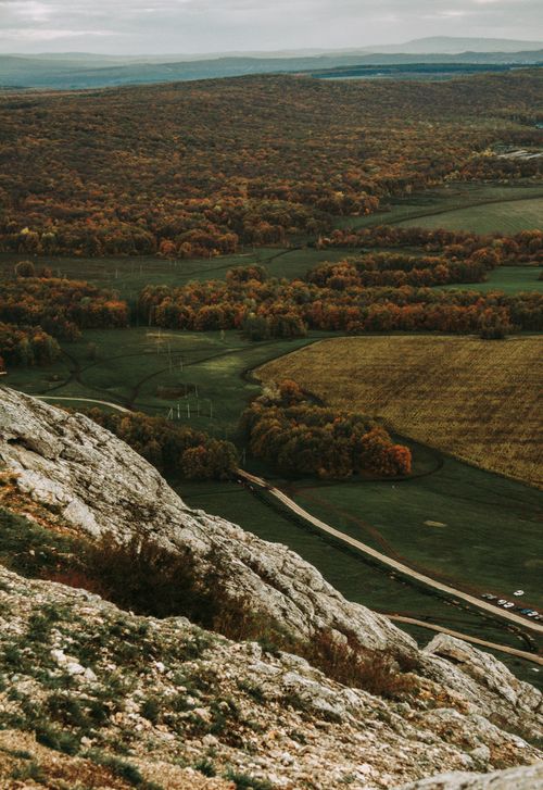 Free Breathtaking aerial view of Bashkortostan's rolling hills and lush forests in autumn. Stock Photo