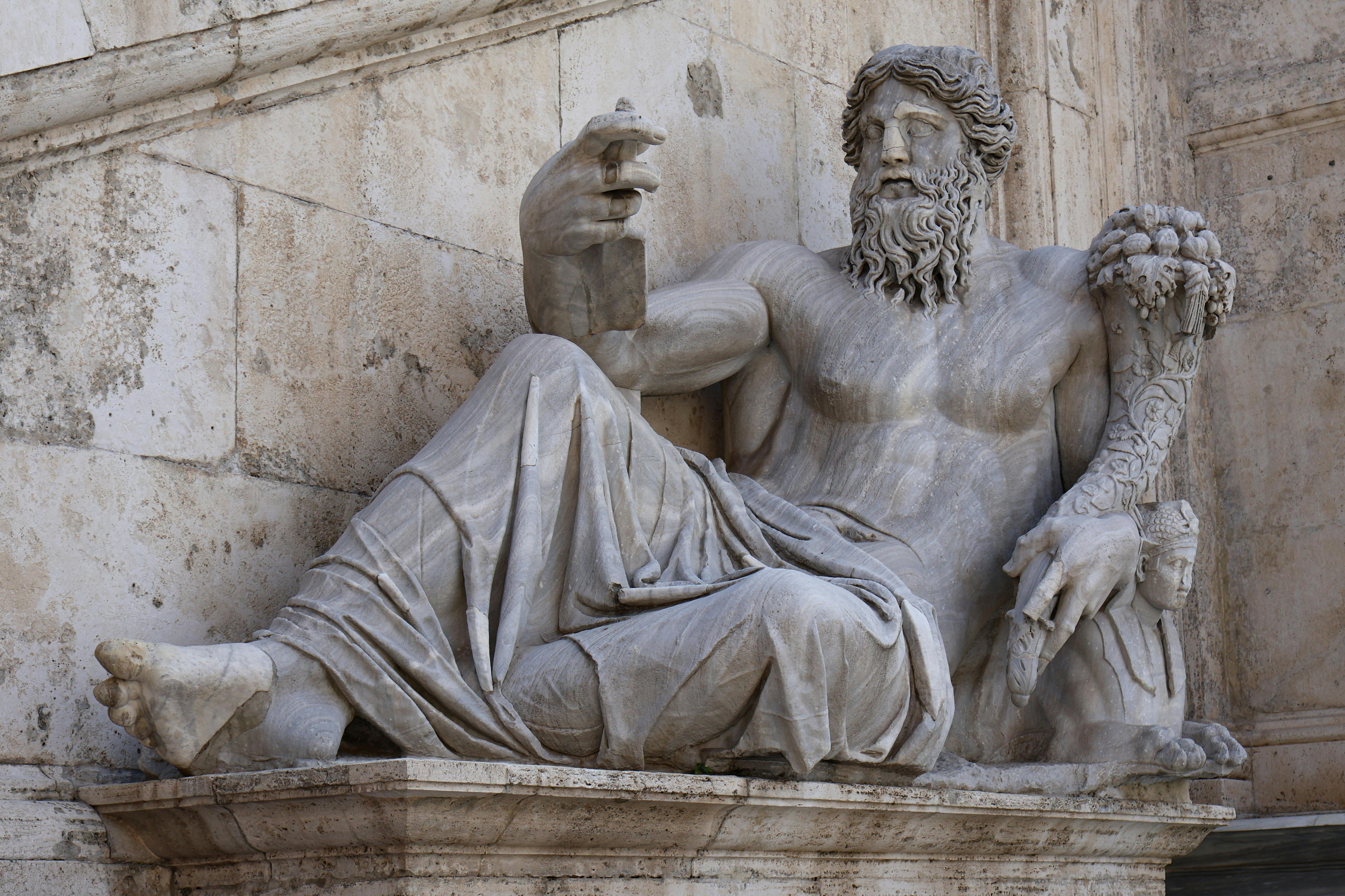 Intricate marble sculpture showcasing Roman heritage at an ancient site in Rome, Italy.