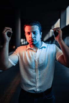 Portrait of a young man in dramatic lighting indoors, Ankara, Türkiye.