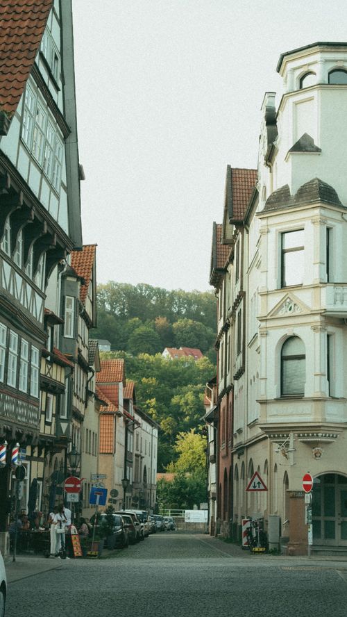 Free Picturesque European street lined with historic half-timbered buildings under a clear sky. Stock Photo