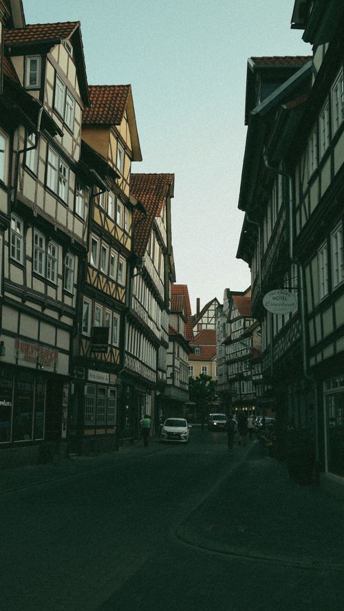 Free A picturesque street lined with traditional half-timbered houses in a European town. Stock Photo