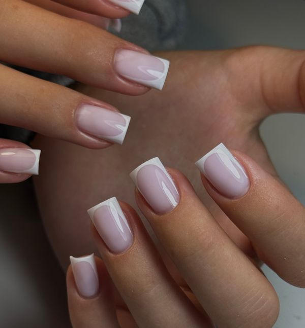 Elegant milky white almond-shaped manicure