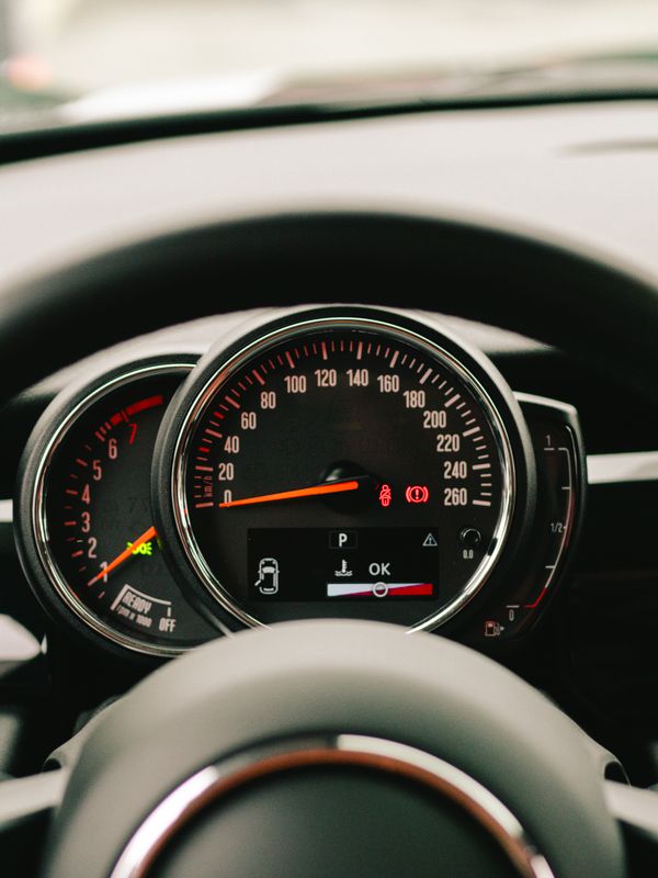 A close up of a dashboard with a speedometer · Free Stock Photo