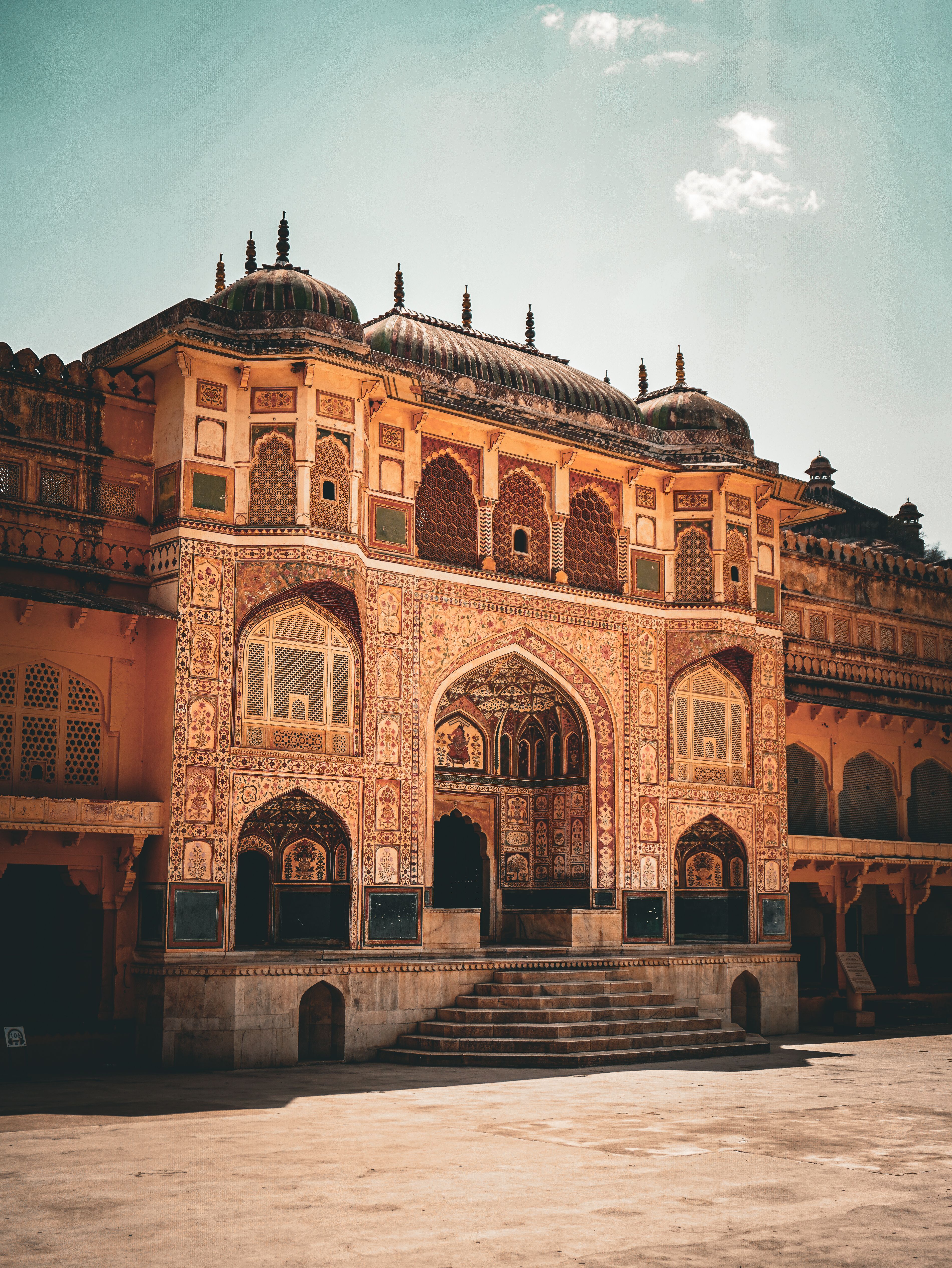 The sunlit archway and architecture of Amber Fort in Jaipur.