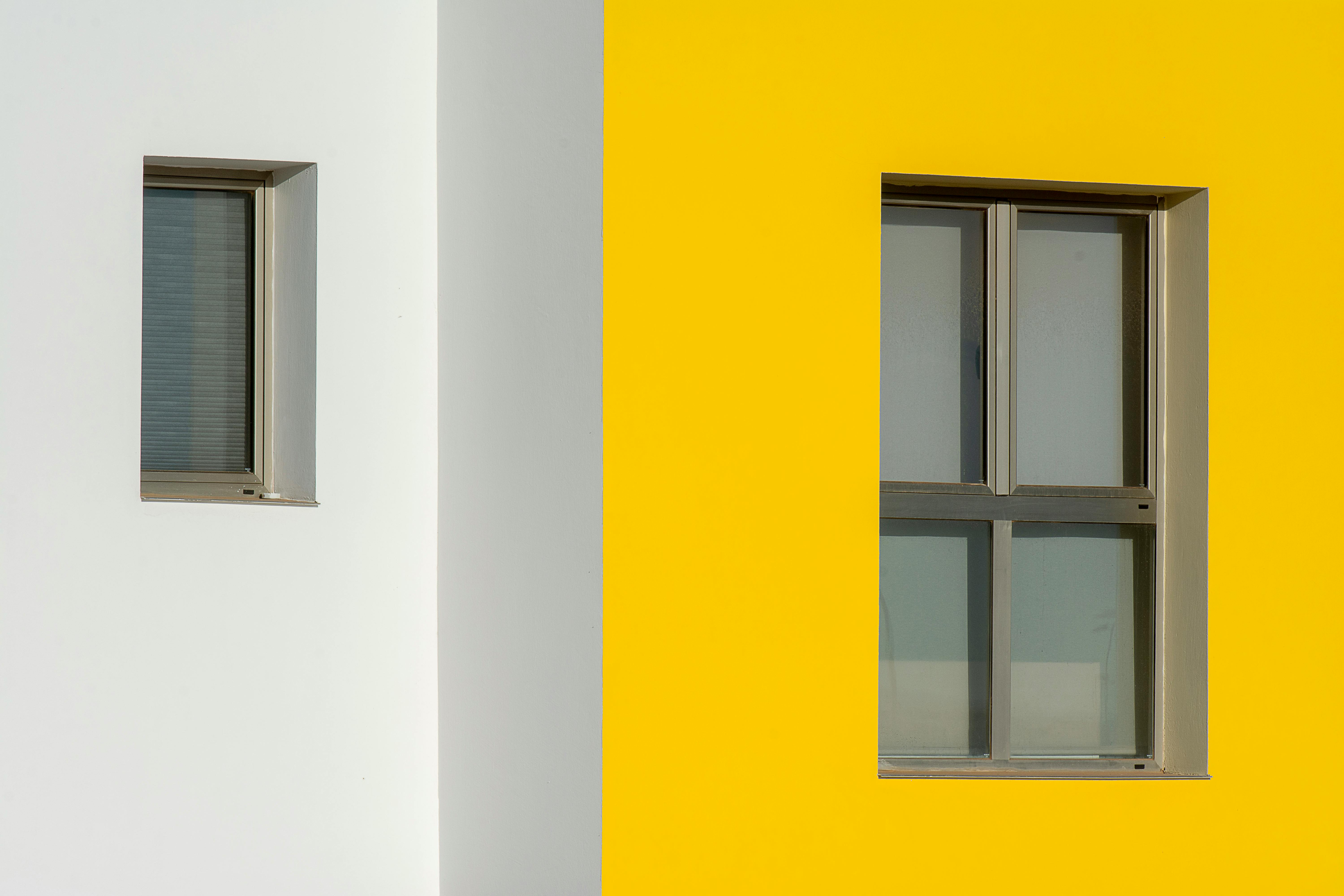 Close-up of contrasting windows with minimalist design and bright colors.