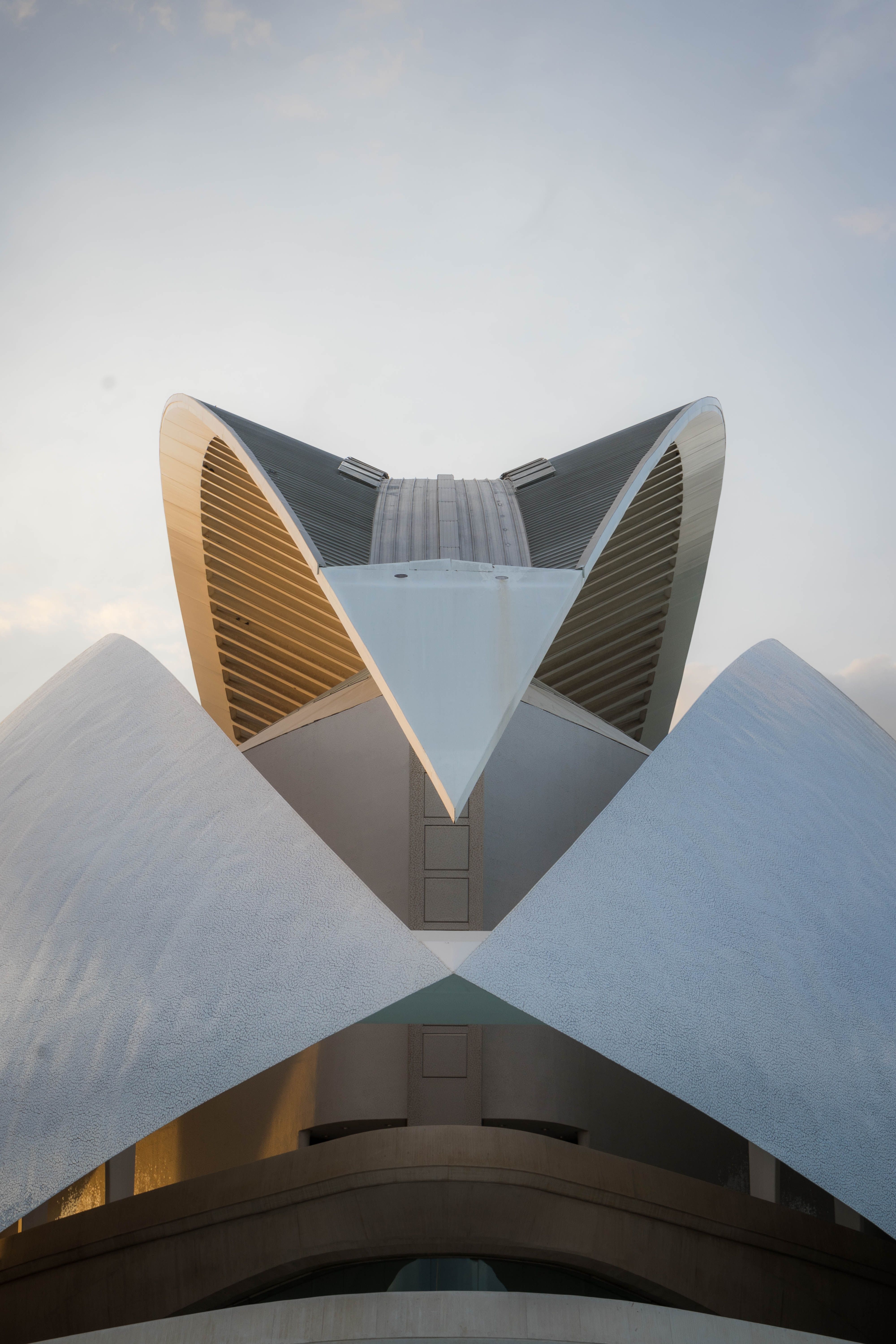 Modern architectural structure resembling futuristic design, captured in daylight.