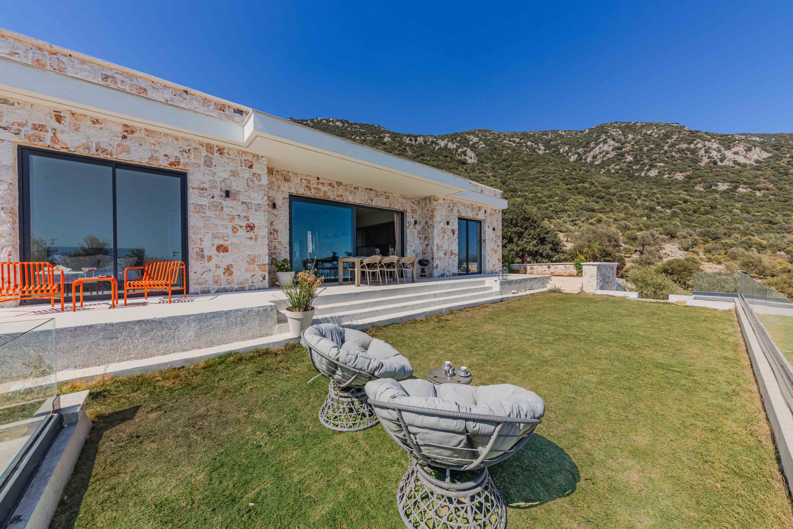 Berkeley Hills Terrace — spacious outdoor stone patio with mountain views, elegant modern residence