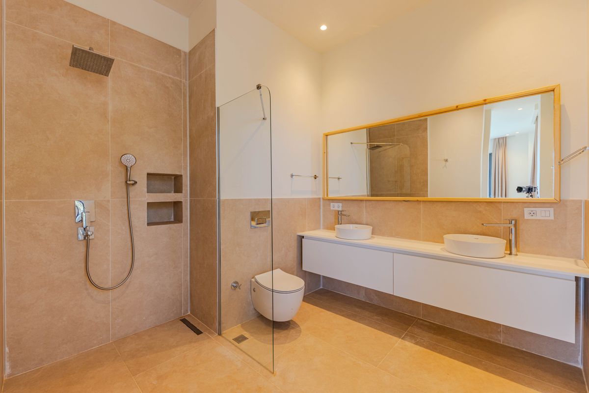 Minimalist bathroom with beige tiles