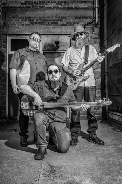 Outdoor promo with three musicians