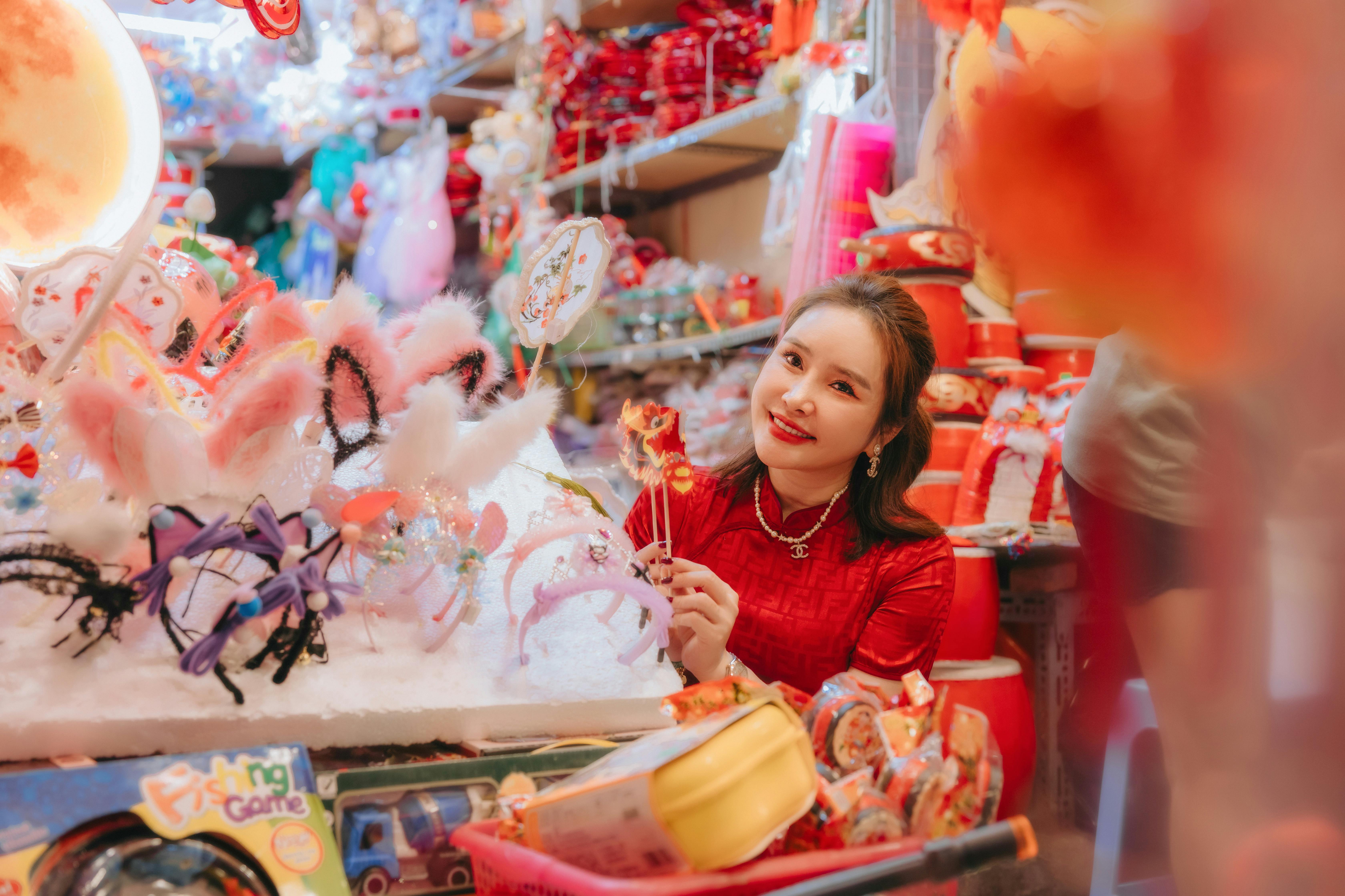 a woman in red is shopping for chinese new year