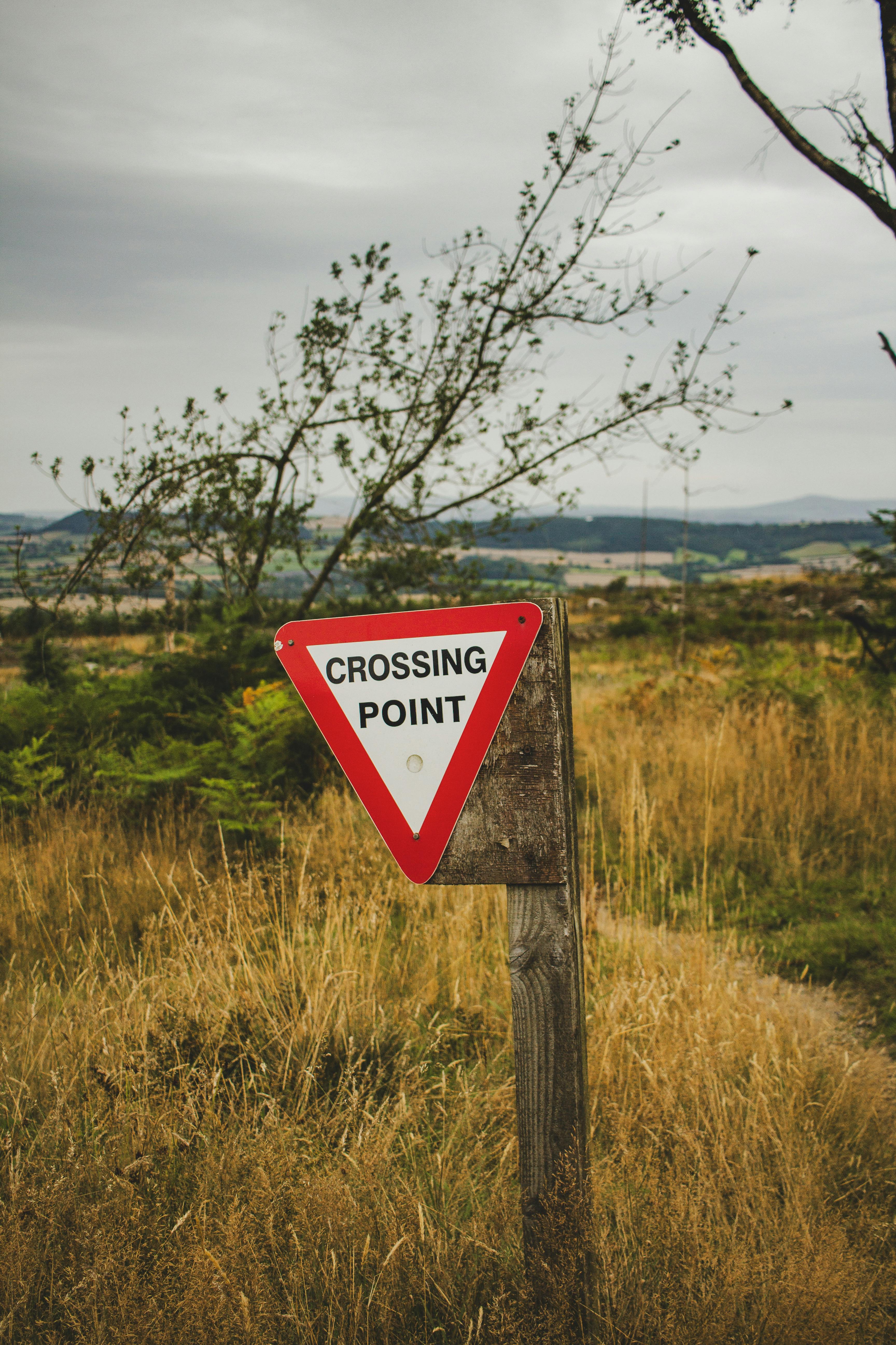 a sign that says smoking point in the middle of a field