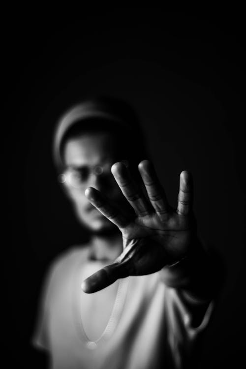Free Grayscale Photography of Man Reaching Stock Photo