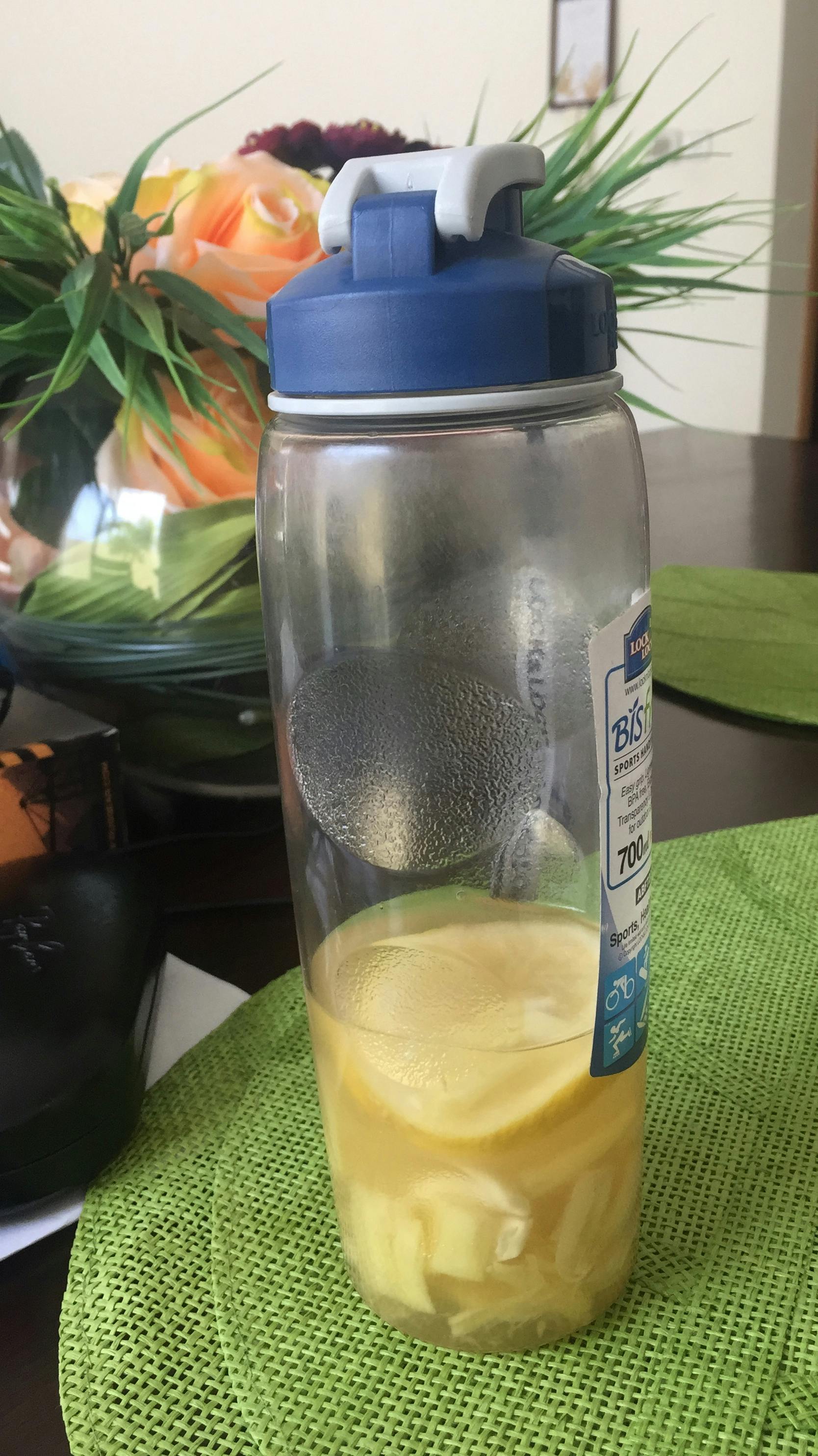 City street at night with buildings and streetlights in an urban neighborhood.