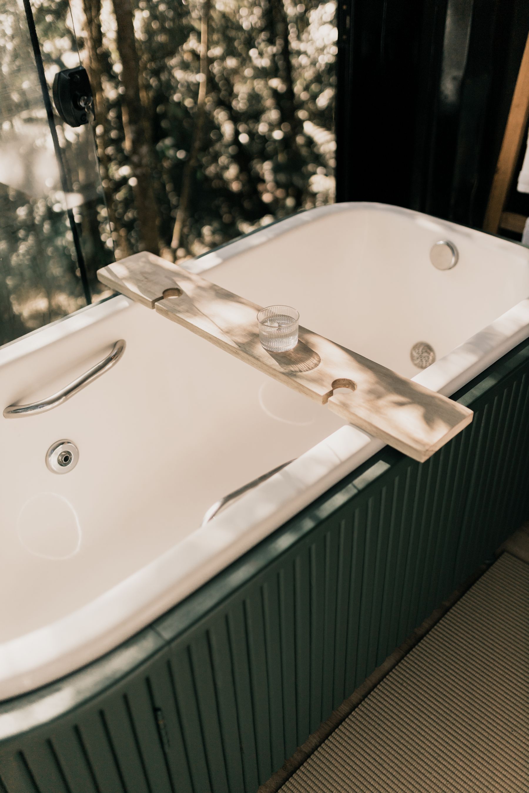 Japanese-inspired bathroom with soft daylight and restrained natural materials