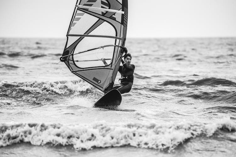 Grayscale Photo Of Man Surfing