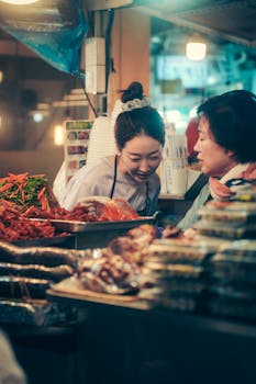 A vibrant scene capturing Korean tradition with women in a bustling Seoul market stall.