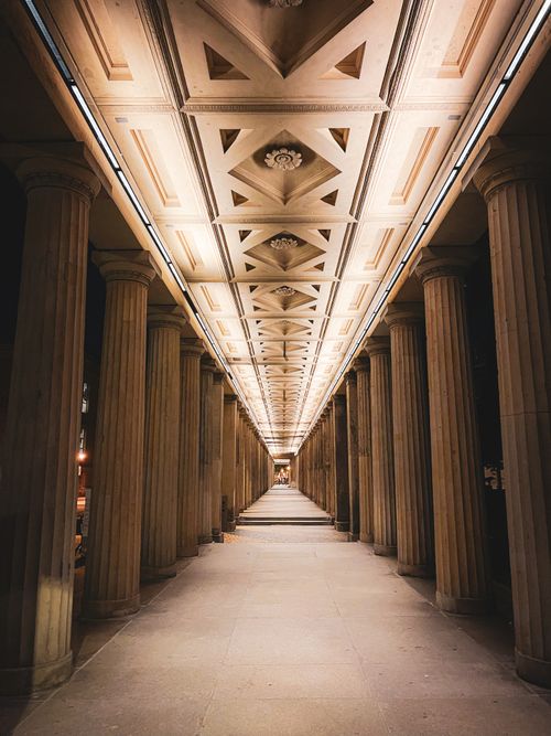 Free Majestic evening view of the colonnade at Alte Nationalgalerie, Berlin showing architectural grandeur. Stock Photo