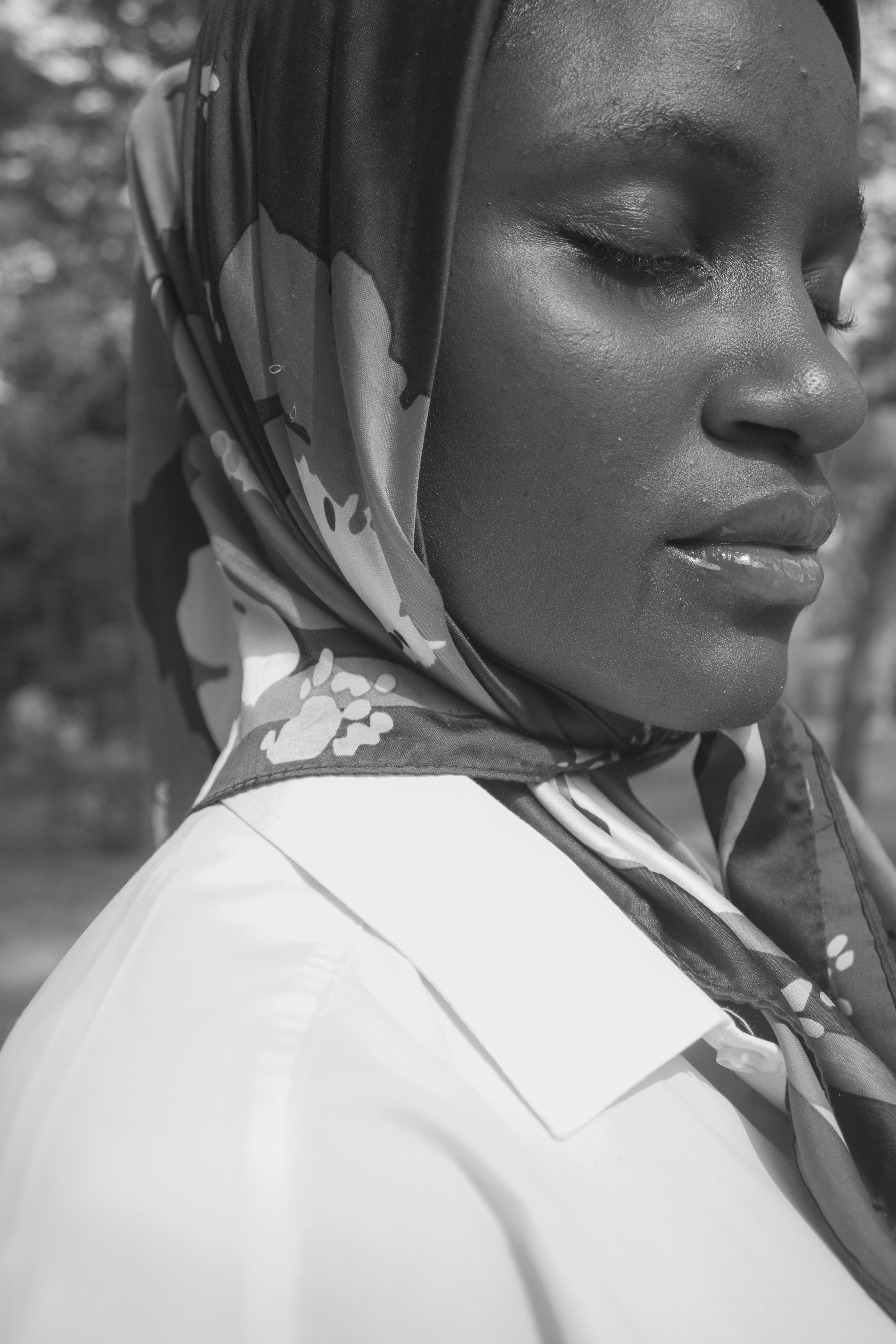 A black and white photo of a woman wearing a head scarf · Free Stock Photo
