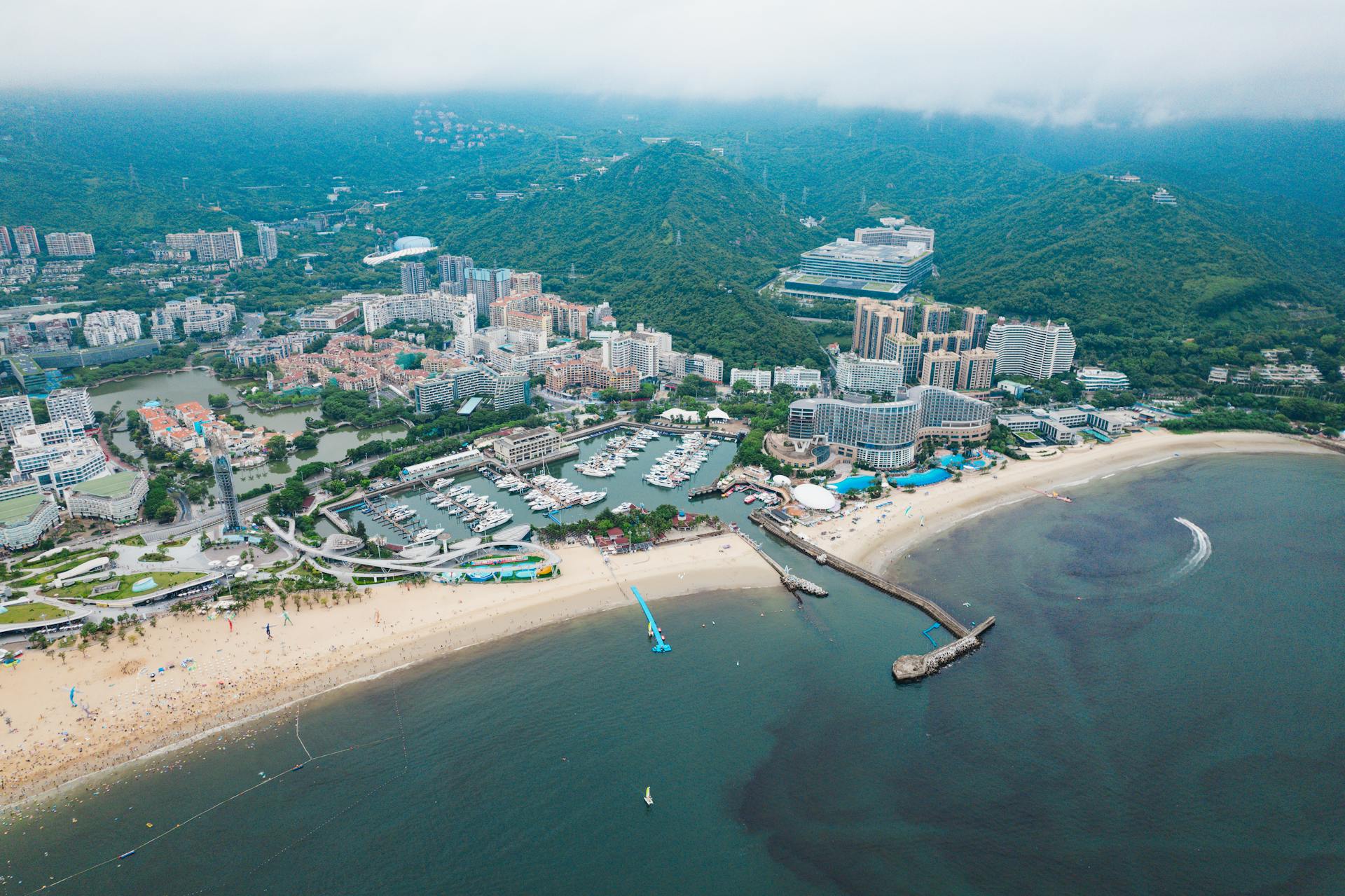 Aerial view of a vibrant beachfront cityscape along Shenzhen Bay in China. Perfect for travel and architecture themes.